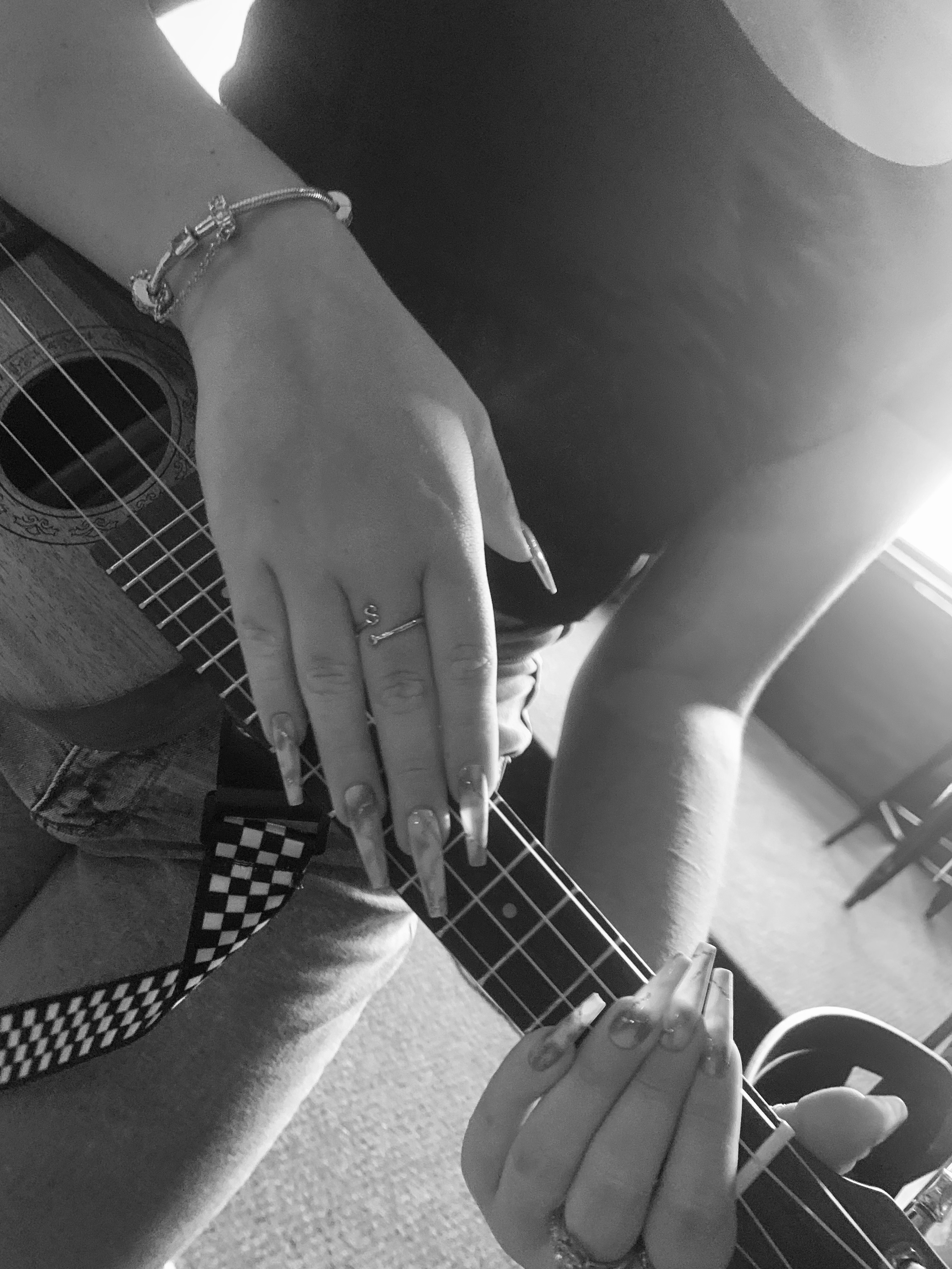 hand on ukulele B&W